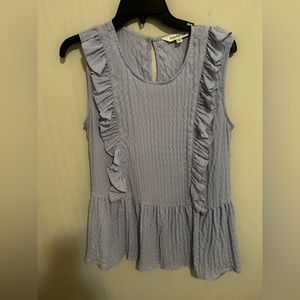 Very cute light weight top. Purchased from a local Boutique .